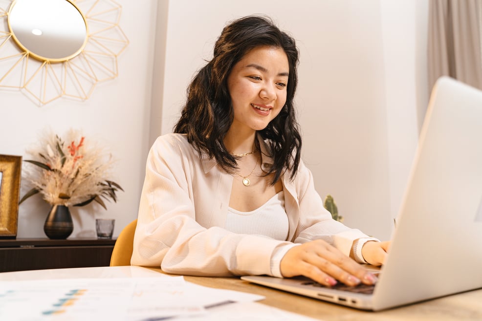 woman-working-on-laptop-smiling